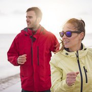 Couple jogging in the bad weather